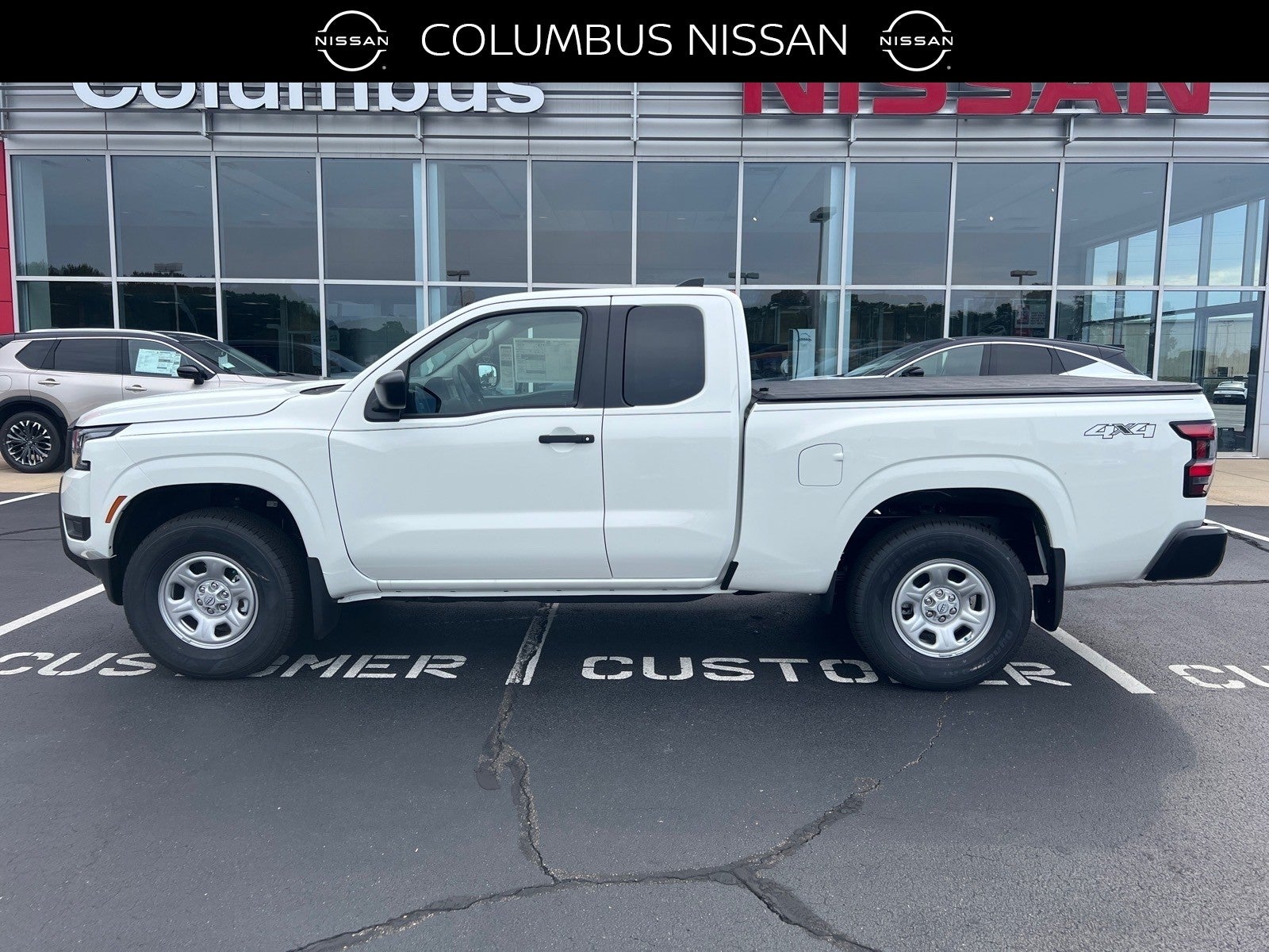 2026 Nissan Frontier S in White — front three-quarter view
