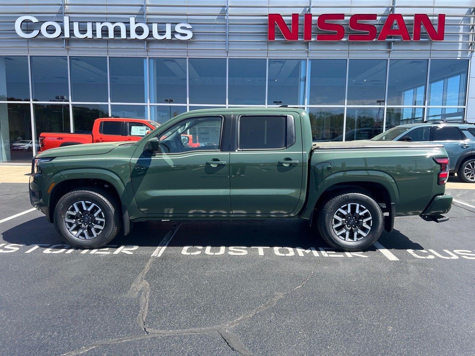 2026 Nissan Frontier SV in Green — front three-quarter view