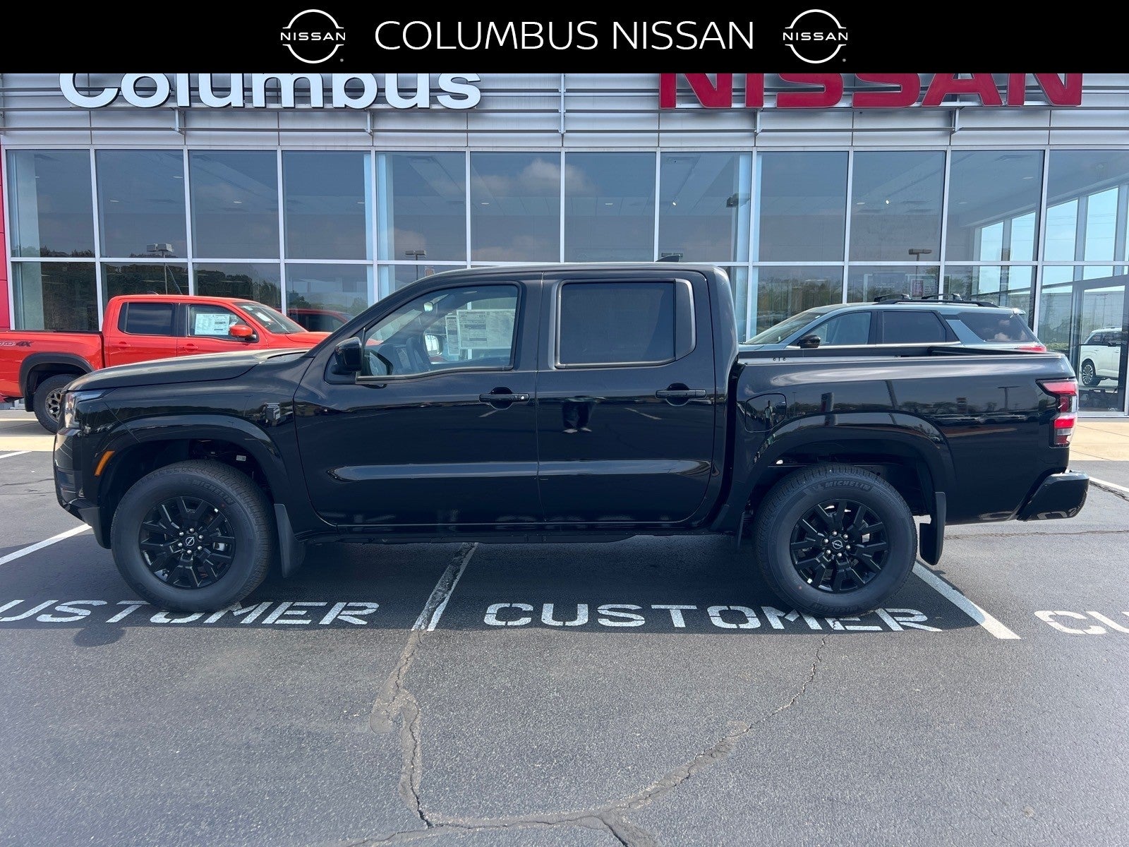 2026 Nissan Frontier SV in Black — front three-quarter view