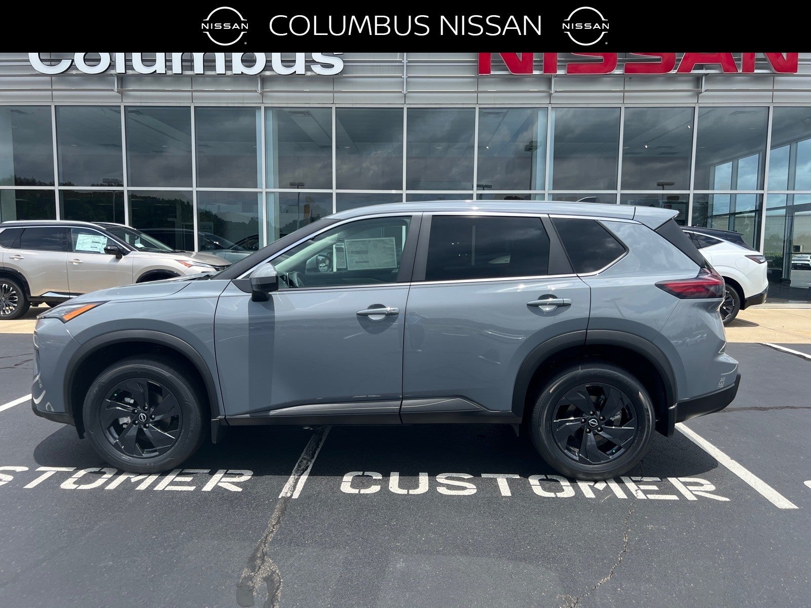 2026 Nissan Rogue SV in Gray — front three-quarter view
