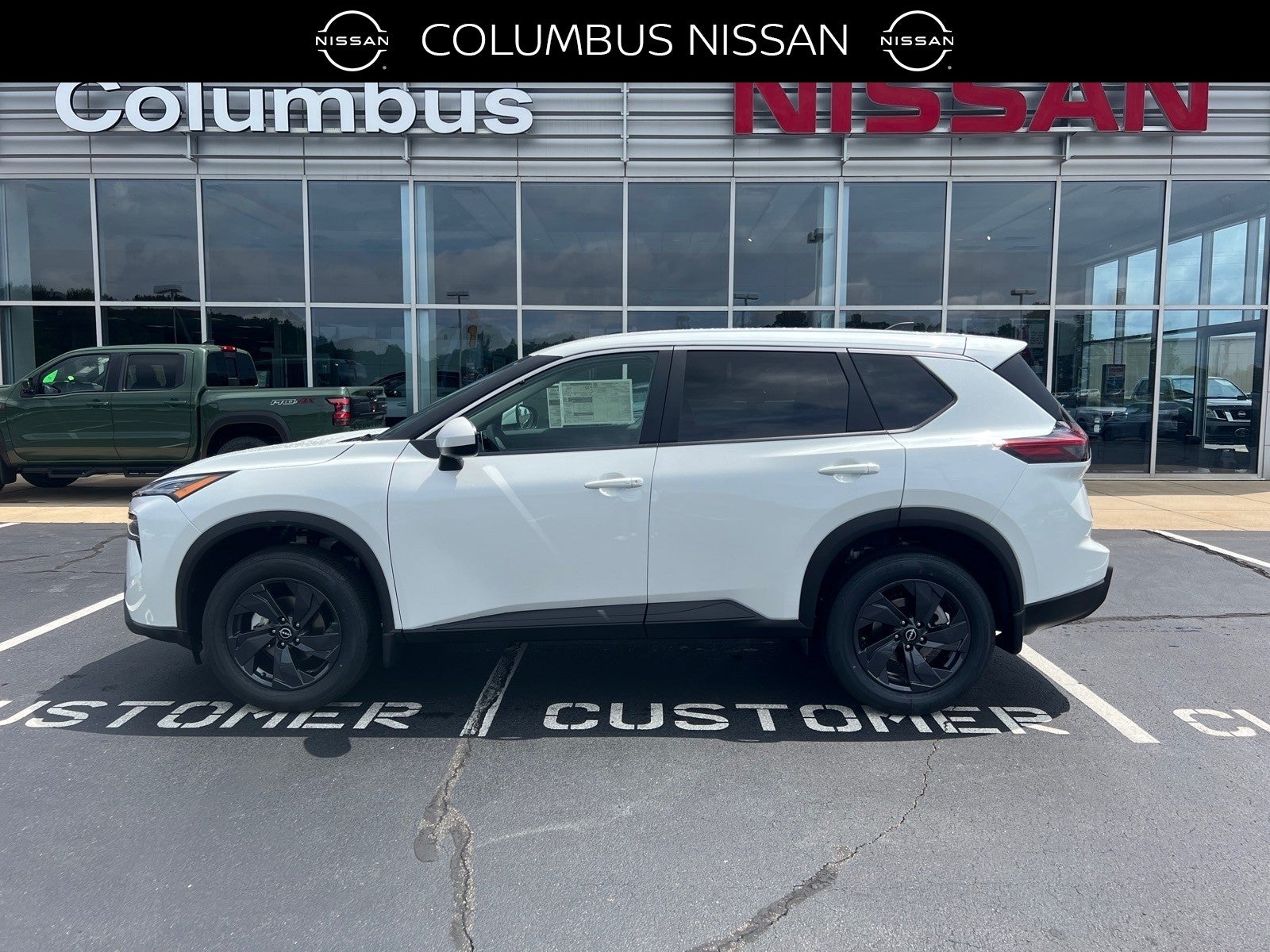 2026 Nissan Rogue SV in White — front three-quarter view