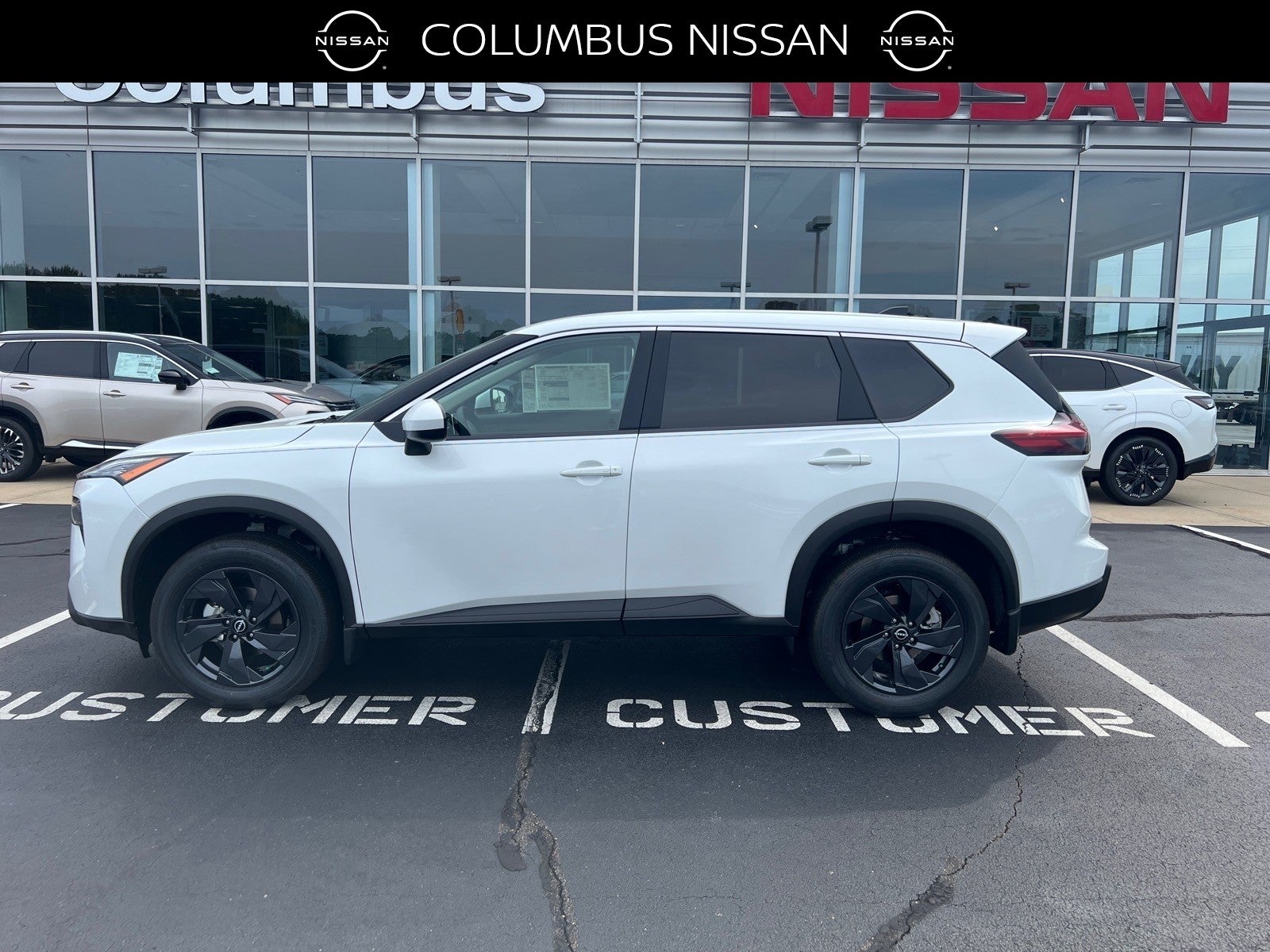 2026 Nissan Rogue SV in White — front three-quarter view