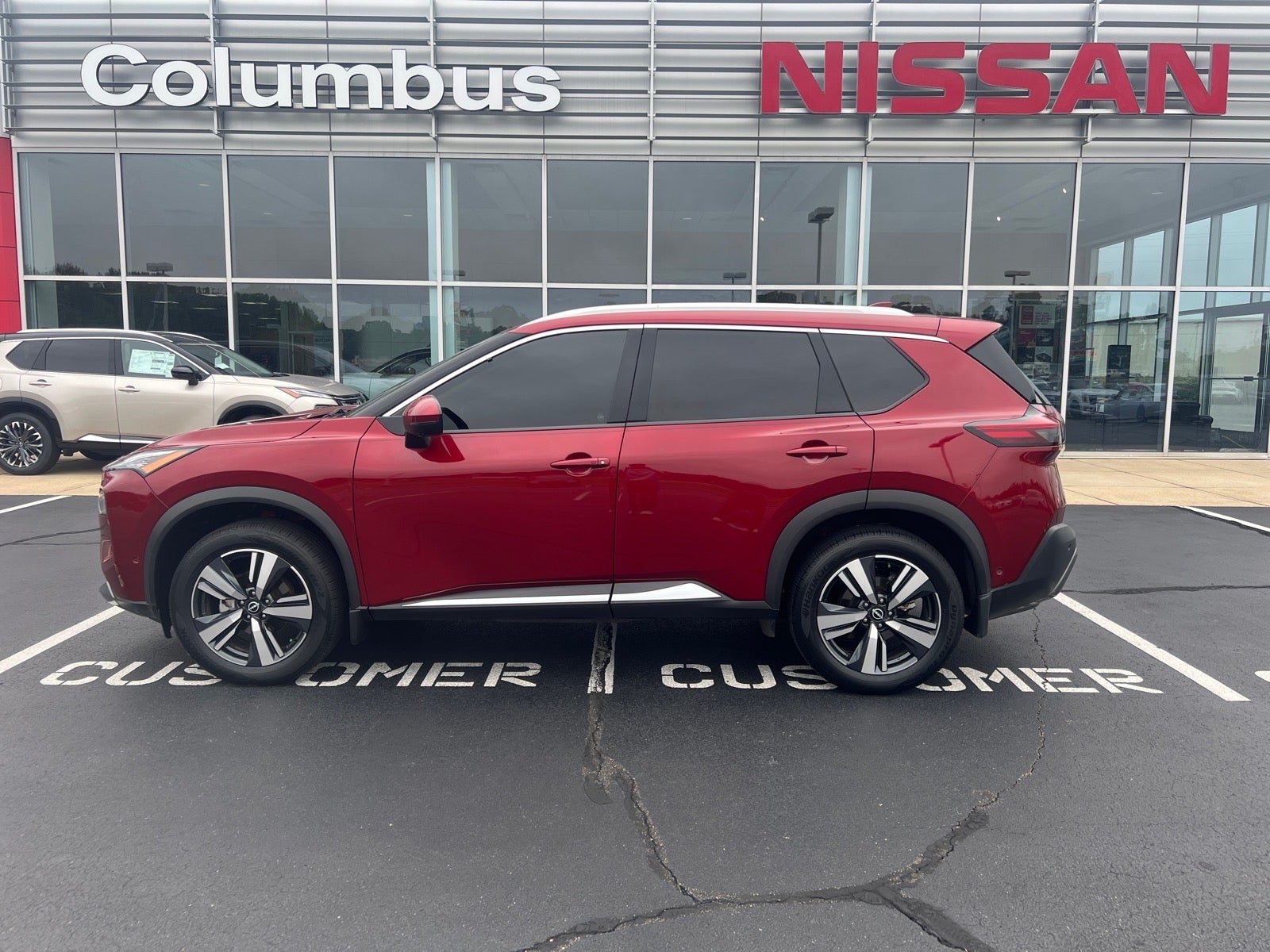 2023 Nissan Rogue SL in Red — front three-quarter view