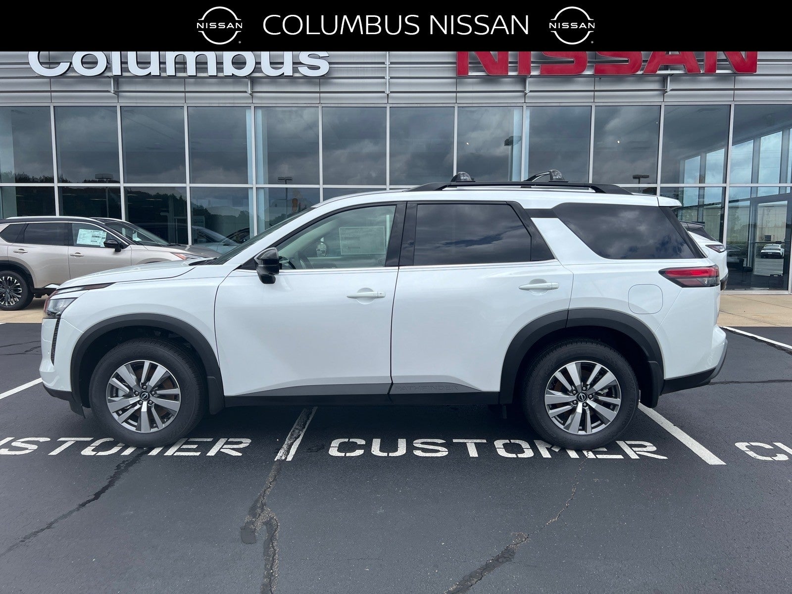 2026 Nissan Pathfinder SL in White — front three-quarter view