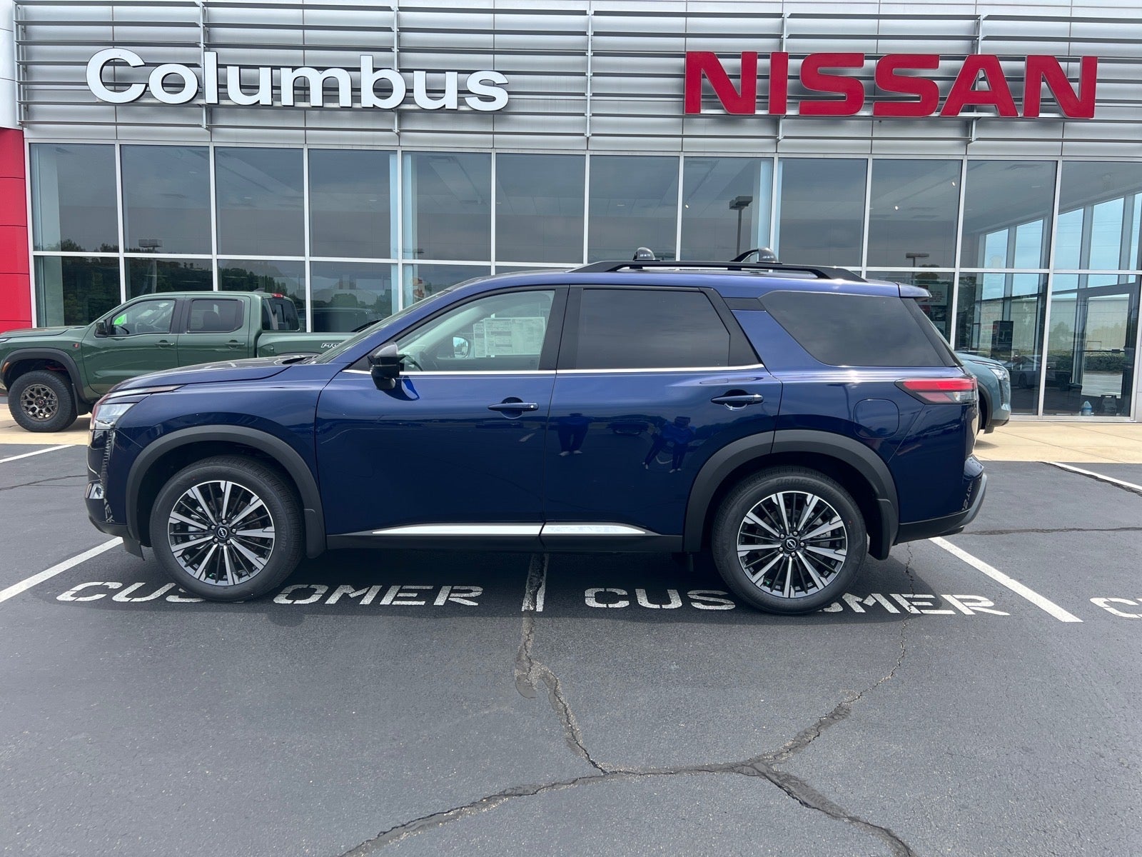 2026 Nissan Pathfinder Platinum in Blue — front three-quarter view