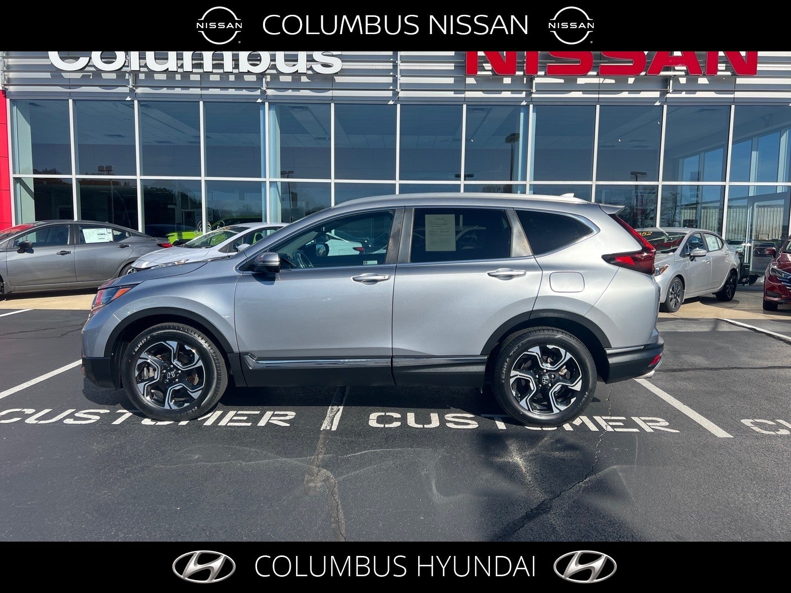 2019 Honda CR-V Touring in Silver — front three-quarter view