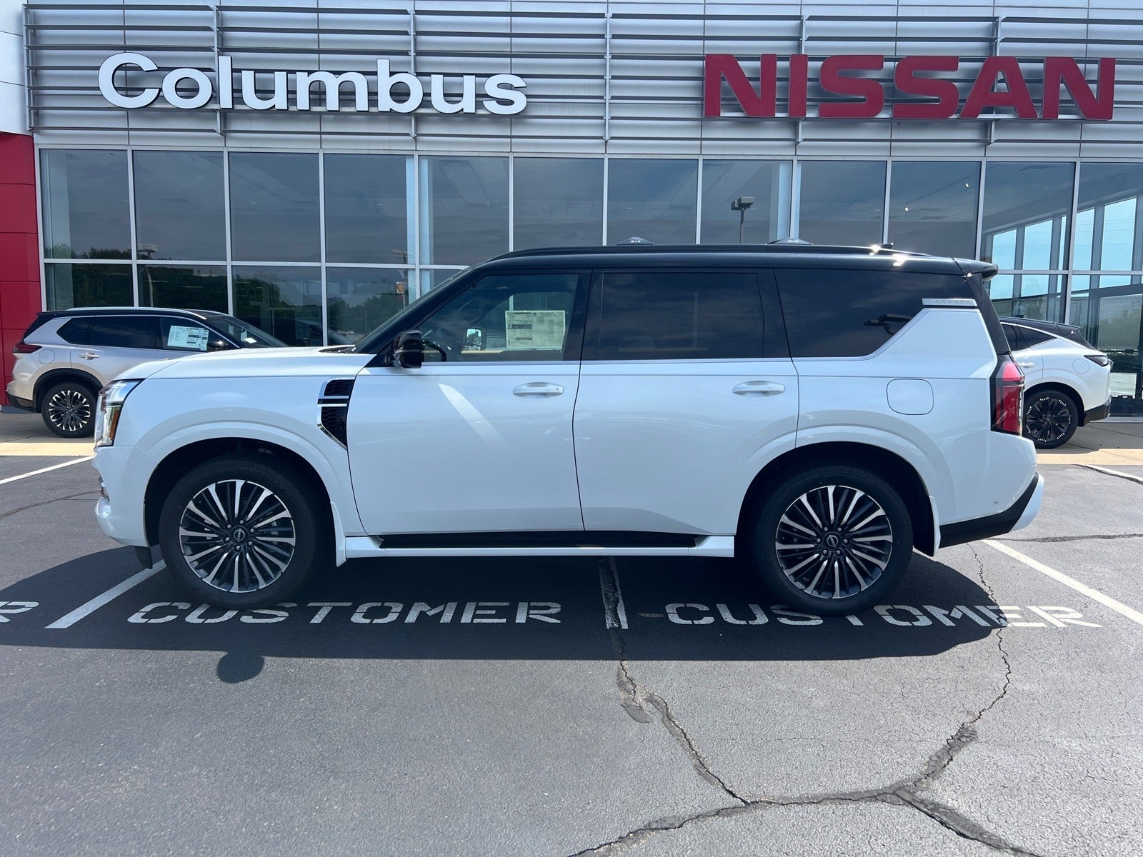 2026 Nissan Armada Platinum Reserve in White — front three-quarter view