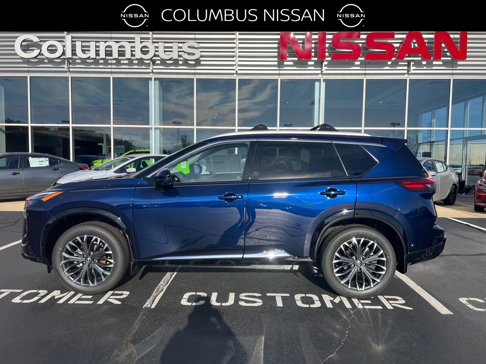 2026 Nissan Rogue Platinum in Blue — front three-quarter view